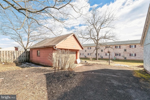 exterior space with a garage and an outdoor structure