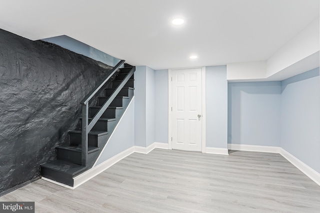 basement featuring light wood-type flooring