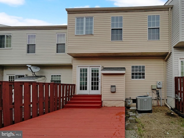 rear view of house featuring central air condition unit