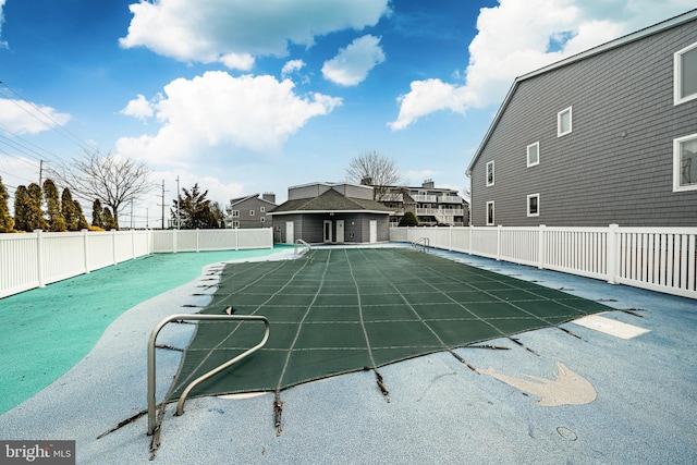 view of pool featuring a storage structure, an outdoor structure, fence, a fenced in pool, and a patio area