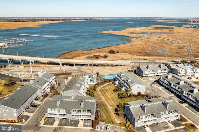 birds eye view of property featuring a water view and a residential view