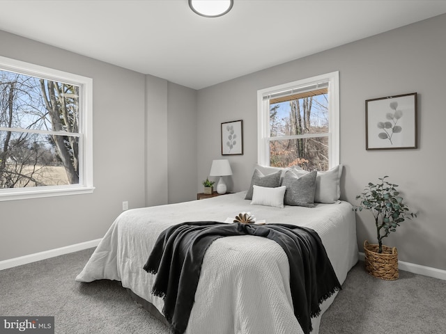 carpeted bedroom with baseboards