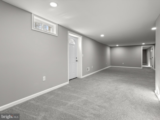 below grade area with recessed lighting, carpet flooring, and baseboards