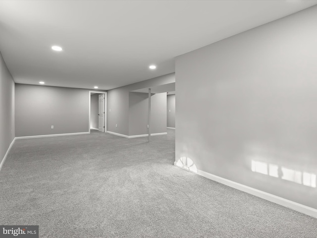 basement with carpet floors, recessed lighting, and baseboards