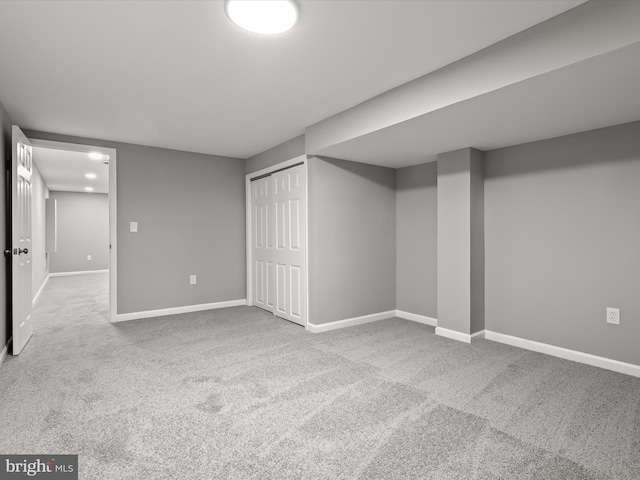 basement featuring carpet and baseboards