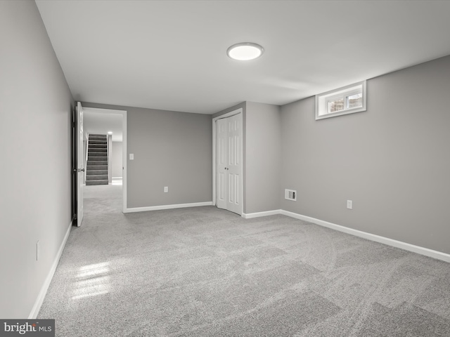 interior space with carpet floors and baseboards