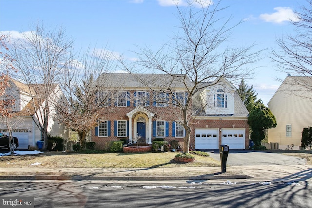 colonial inspired home with central AC and a garage