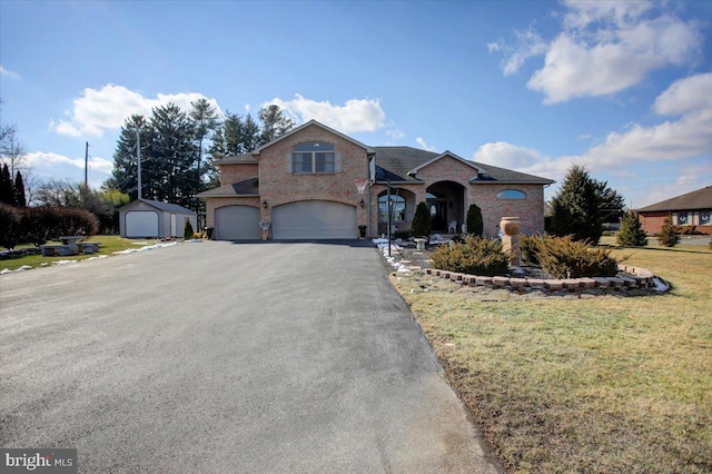 536 Remington Dr, Shippensburg, PA 17257 - view of front of property with a front lawn, an attached garage, brick siding, and driveway
