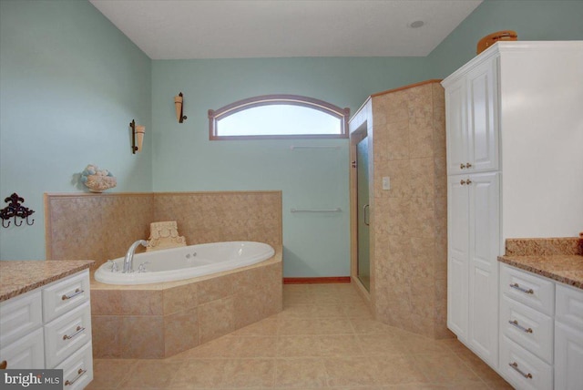 bathroom with vanity, tile patterned flooring, and shower with separate bathtub