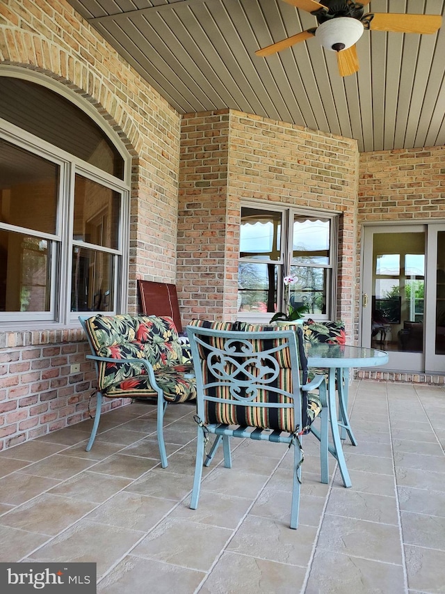 view of patio featuring ceiling fan