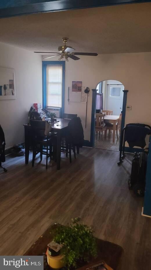 dining room featuring dark hardwood / wood-style floors and ceiling fan