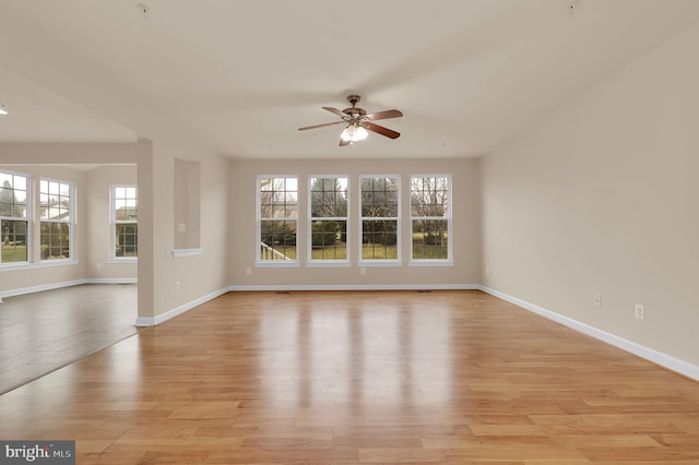 empty room featuring ceiling fan and light wood-type flooring