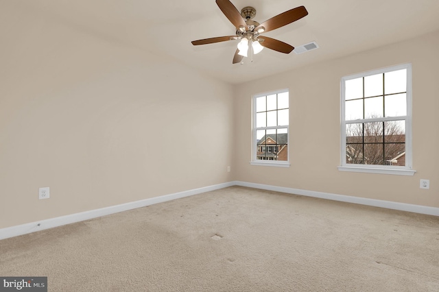 unfurnished room featuring ceiling fan and carpet flooring