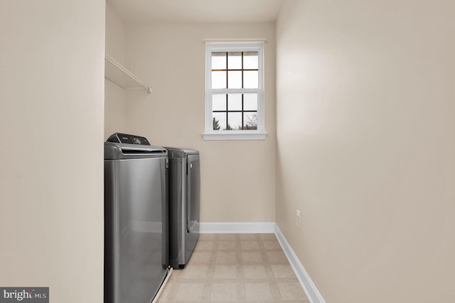 washroom featuring washing machine and dryer