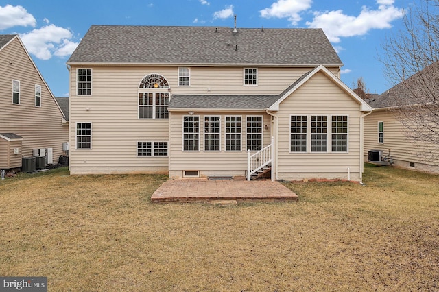 back of property featuring a yard, central AC unit, and a patio area