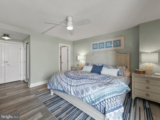 bedroom featuring dark wood-type flooring and ceiling fan