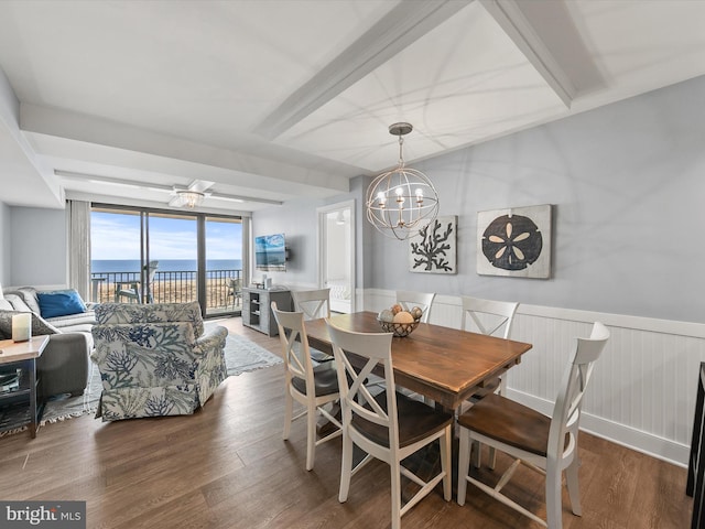 dining space featuring hardwood / wood-style flooring and a chandelier