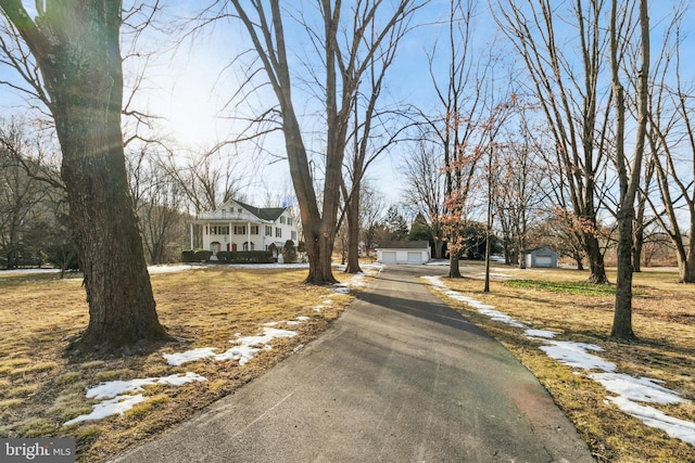 view of road with aphalt driveway