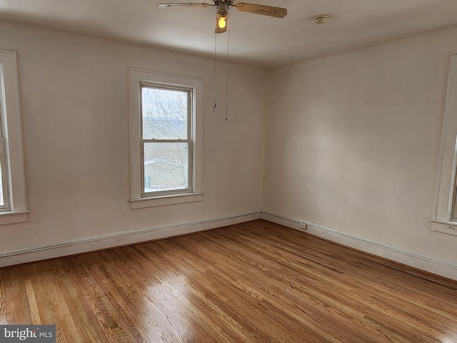 empty room featuring light hardwood / wood-style floors and ceiling fan