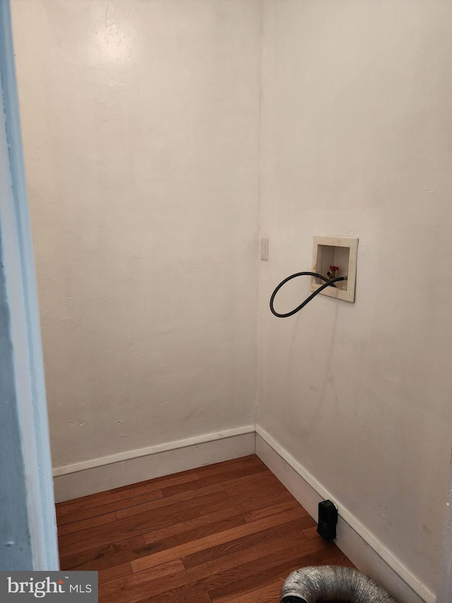 laundry room featuring washer hookup and hardwood / wood-style floors