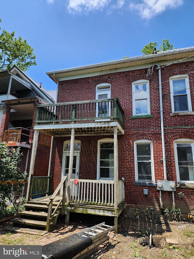 multi unit property featuring a balcony