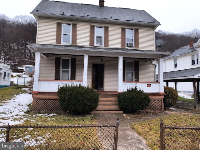 view of front of property featuring cooling unit and a porch