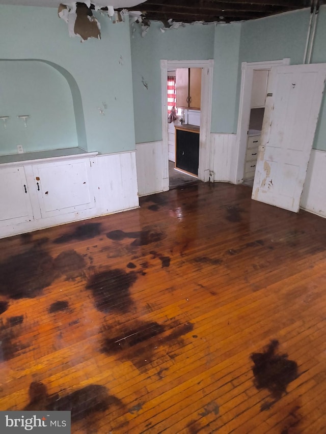 unfurnished room featuring dark hardwood / wood-style flooring