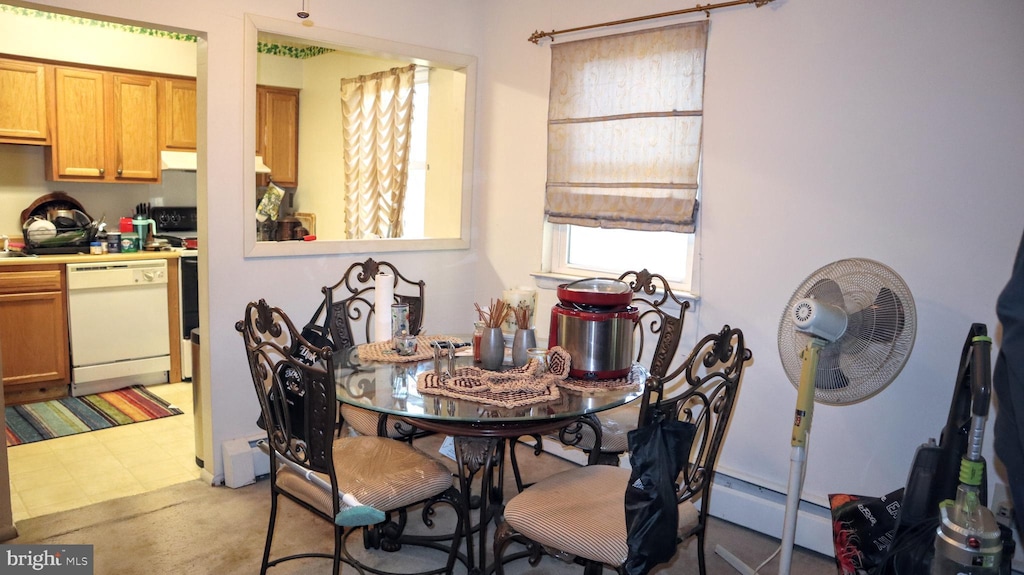 dining area with a baseboard heating unit