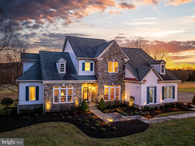 view of front of home with a yard