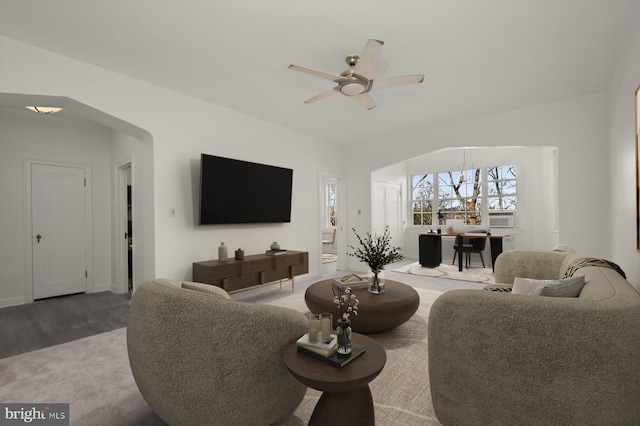 living room featuring ceiling fan and hardwood / wood-style floors