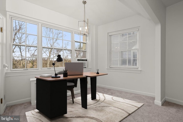 carpeted office space featuring cooling unit, plenty of natural light, and a chandelier