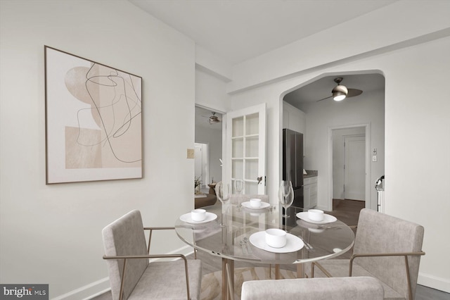 dining space featuring hardwood / wood-style floors and ceiling fan