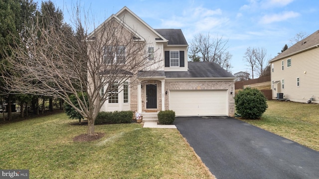 view of front property with cooling unit, a garage, and a front yard