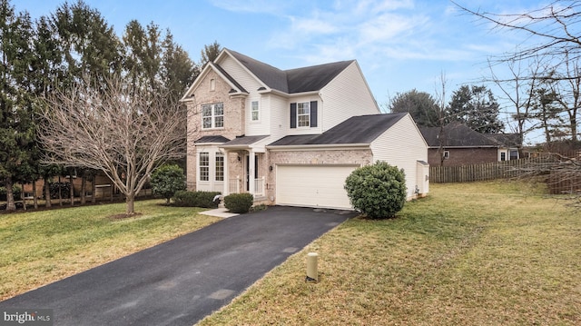 view of front of home featuring a garage and a front lawn