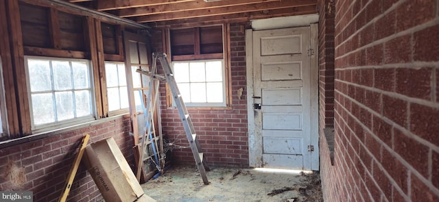 miscellaneous room with brick wall