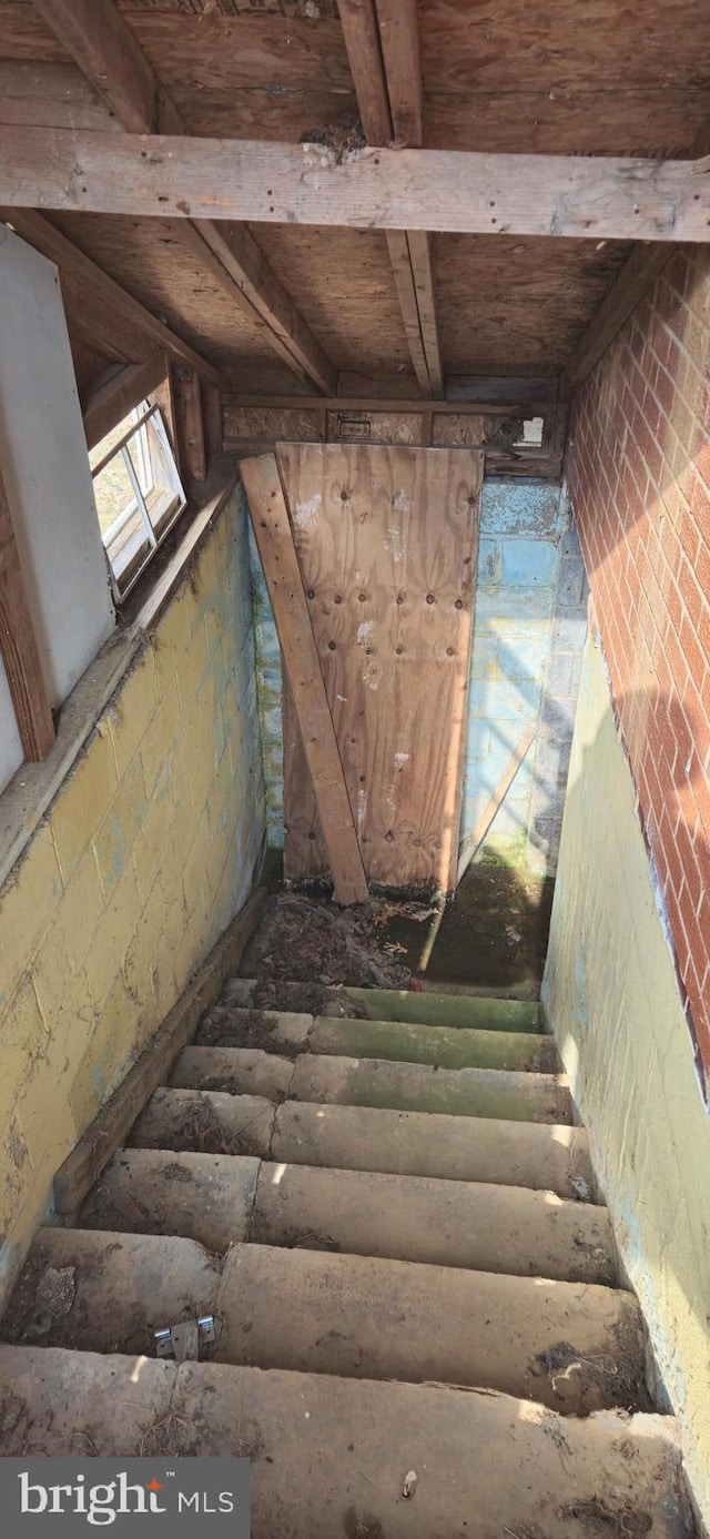 stairs with brick wall