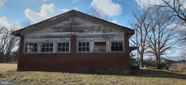 view of property exterior with a yard