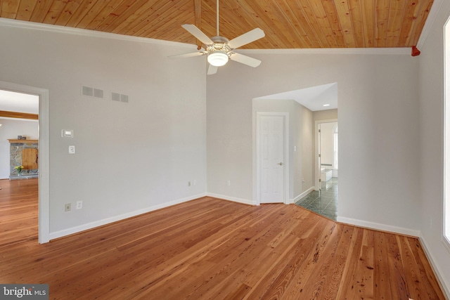 spare room with baseboards, visible vents, and ornamental molding