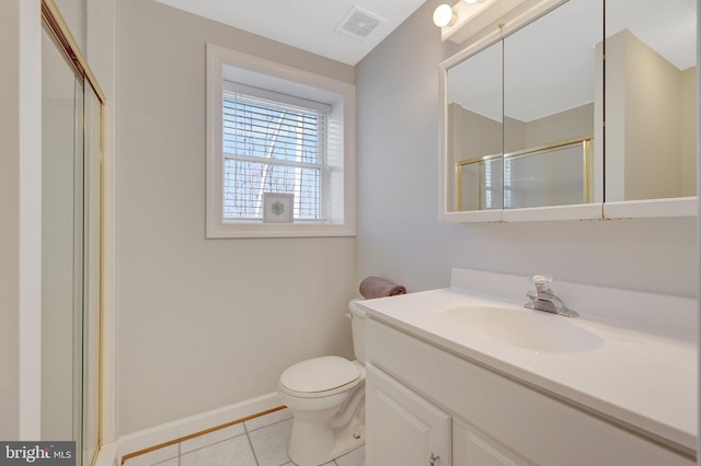 bathroom with a shower with door, visible vents, vanity, baseboards, and tile patterned floors