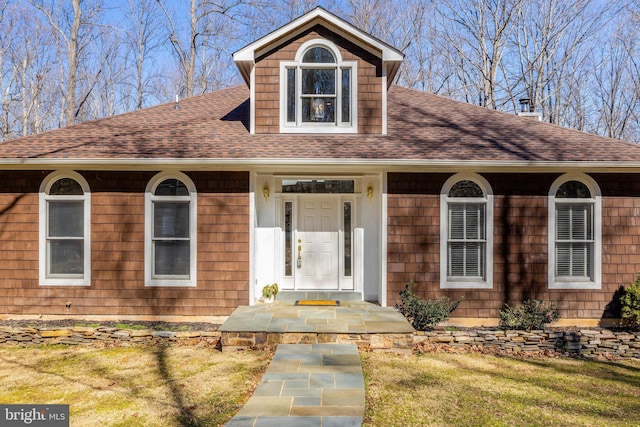 view of front of house with a shingled roof