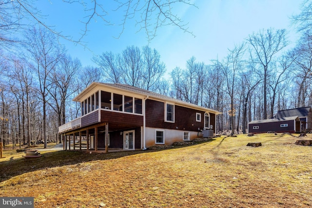 exterior space featuring a sunroom and central AC