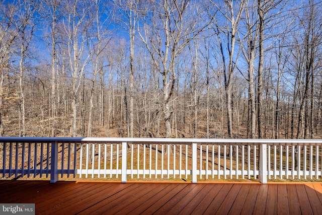 deck featuring a forest view