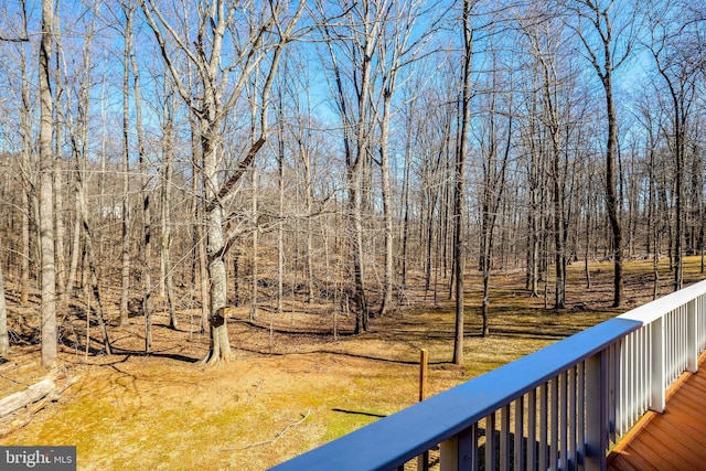 exterior space featuring a view of trees