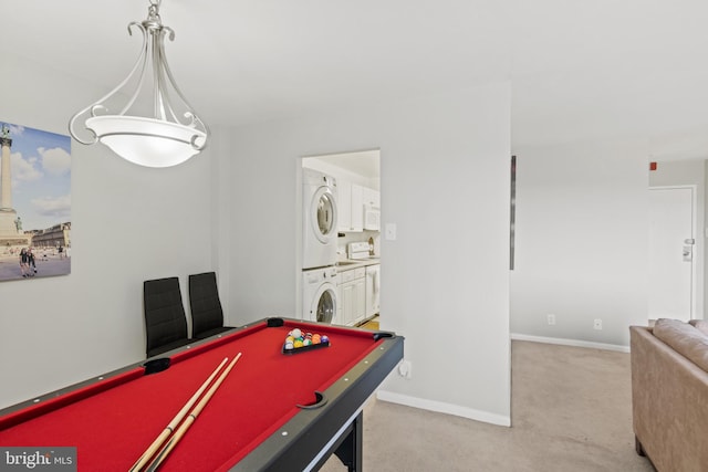 rec room with billiards, stacked washer and clothes dryer, and carpet