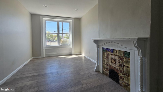 unfurnished living room featuring hardwood / wood-style floors