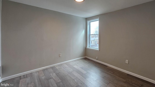 spare room featuring hardwood / wood-style flooring