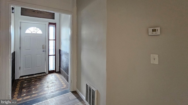 entryway with wood-type flooring