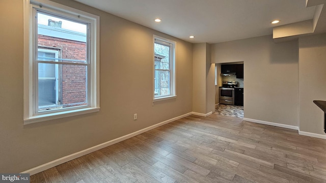 unfurnished room featuring light wood-type flooring