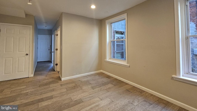 spare room with light hardwood / wood-style floors