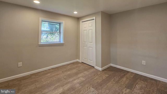 spare room featuring hardwood / wood-style floors